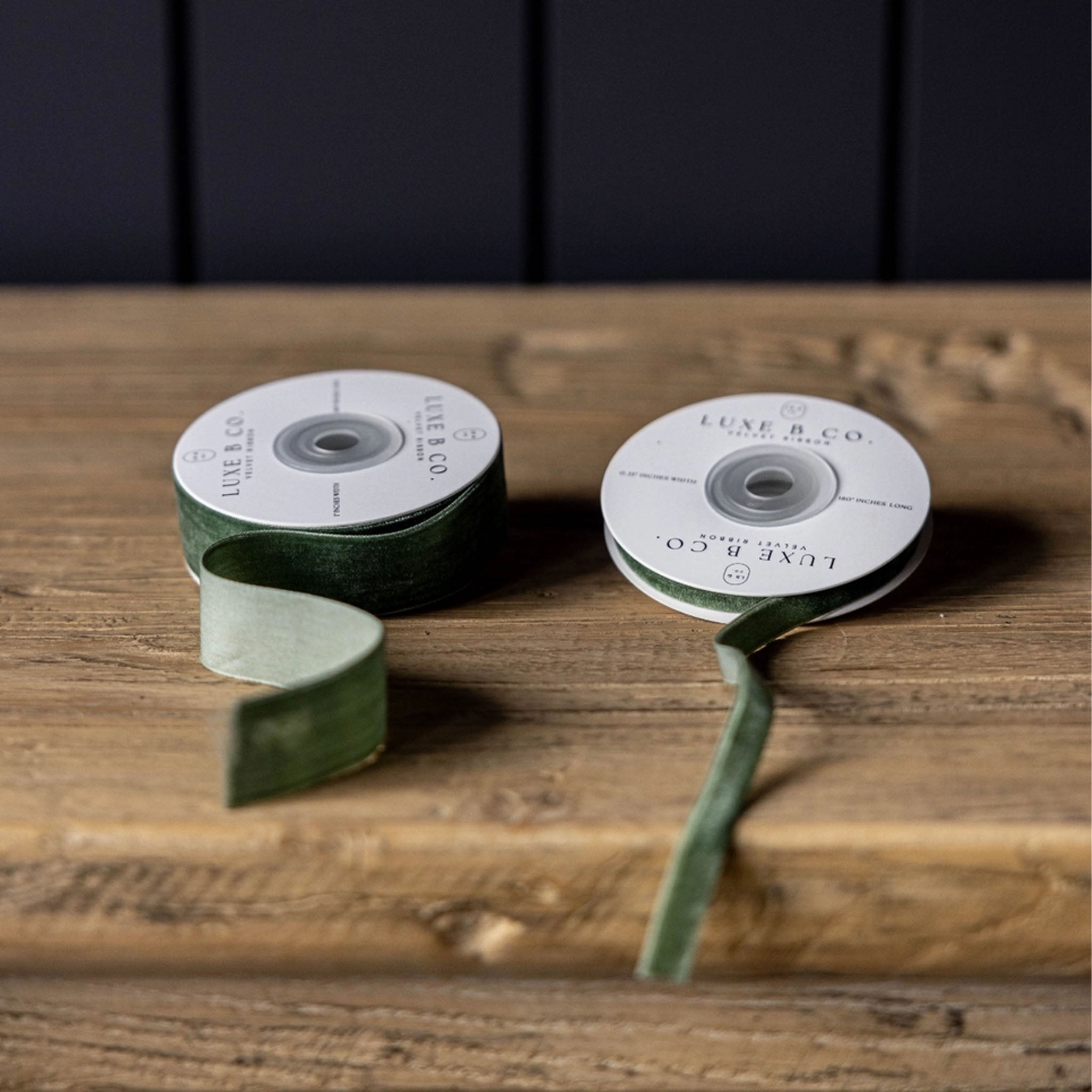 Velvet Ribbon in Forest Green, Small on a wood table at Addison West