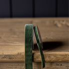 Velvet Ribbon in Forest Green, Medium on a wood table at Addison West