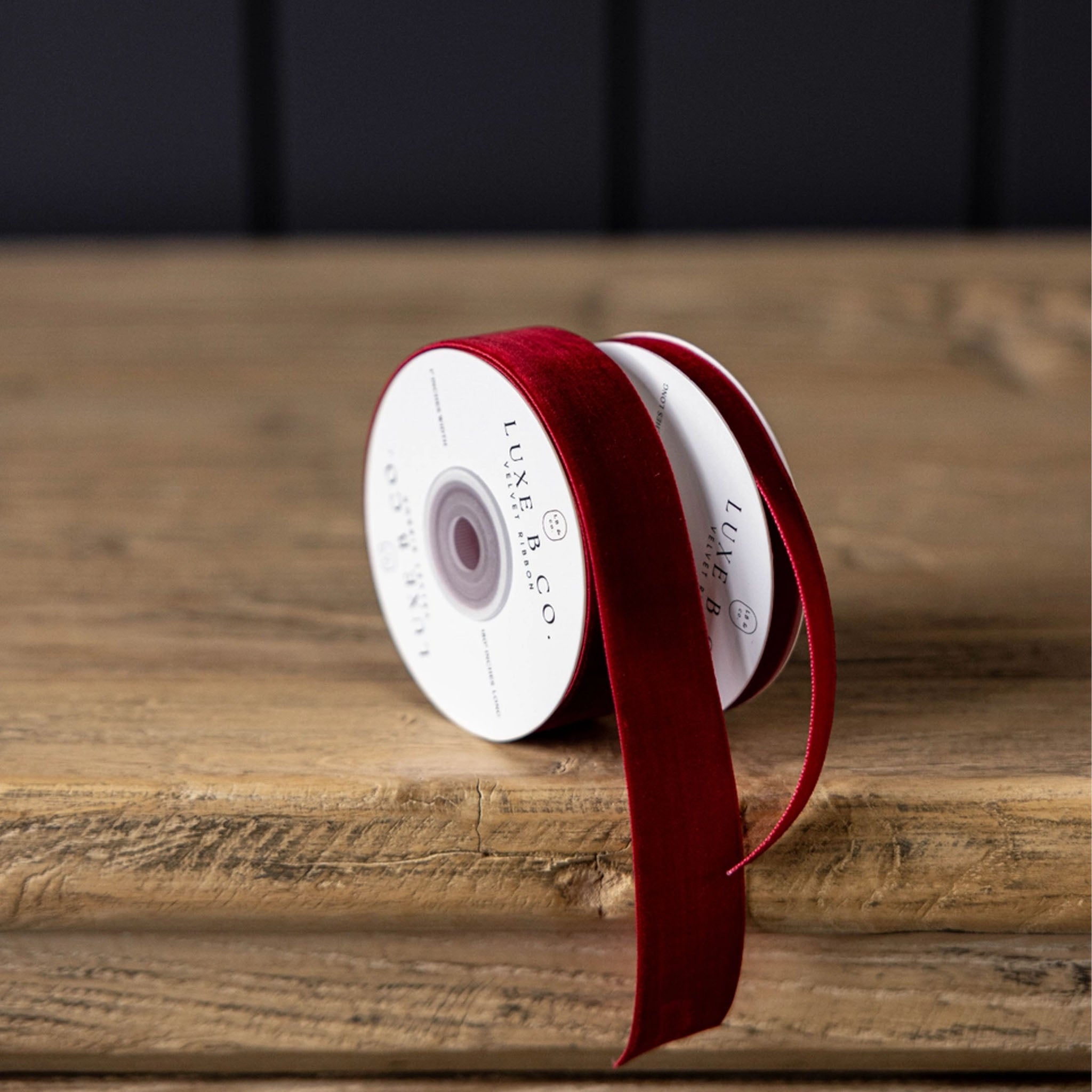 Velvet Ribbon in Red, Small on a wood table at Addison West