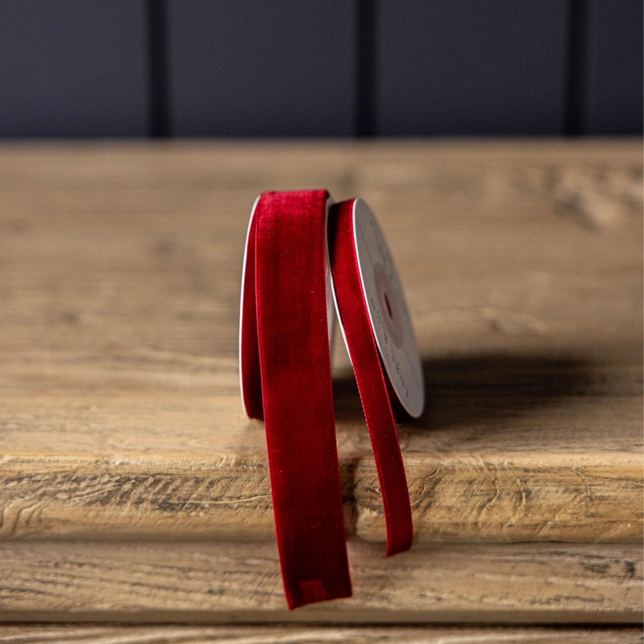 Velvet Ribbon in Red, Medium on a wood table at Addison West