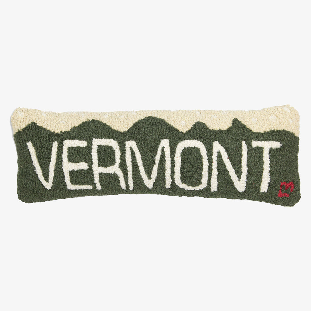 Hand hooked green pillow with Vermont and mountain on a white background