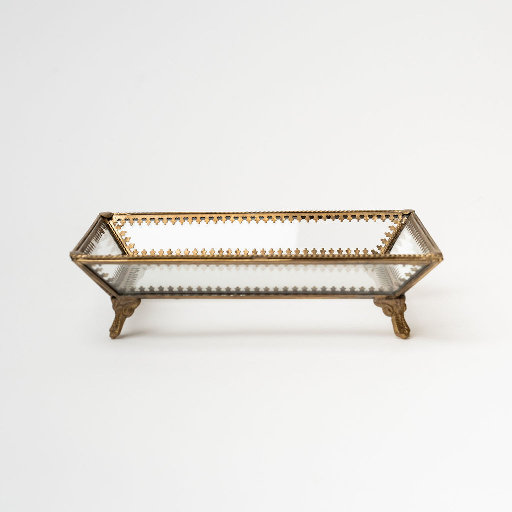 Glass and brass victorian style tray with feet on a white background