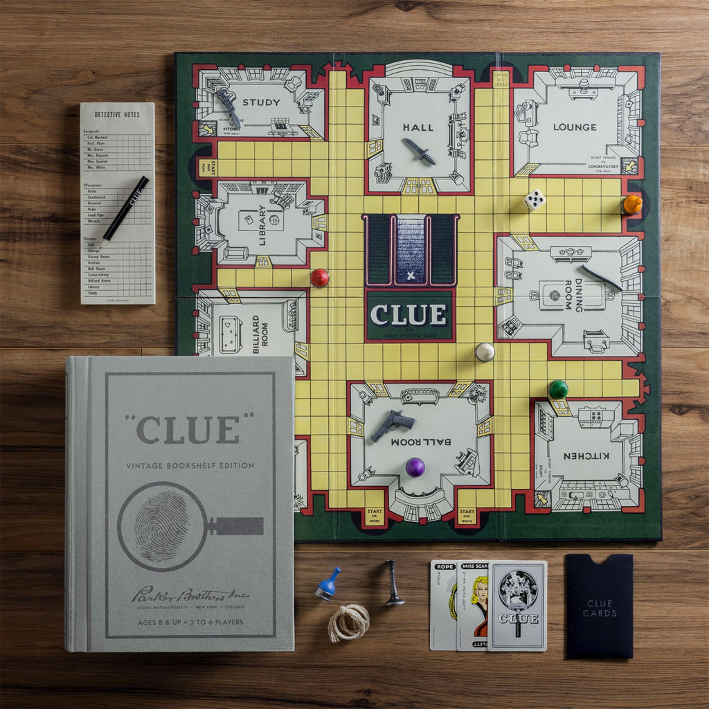 Vintage Bookshelf Edition Clue on a wood table displaying all the game components