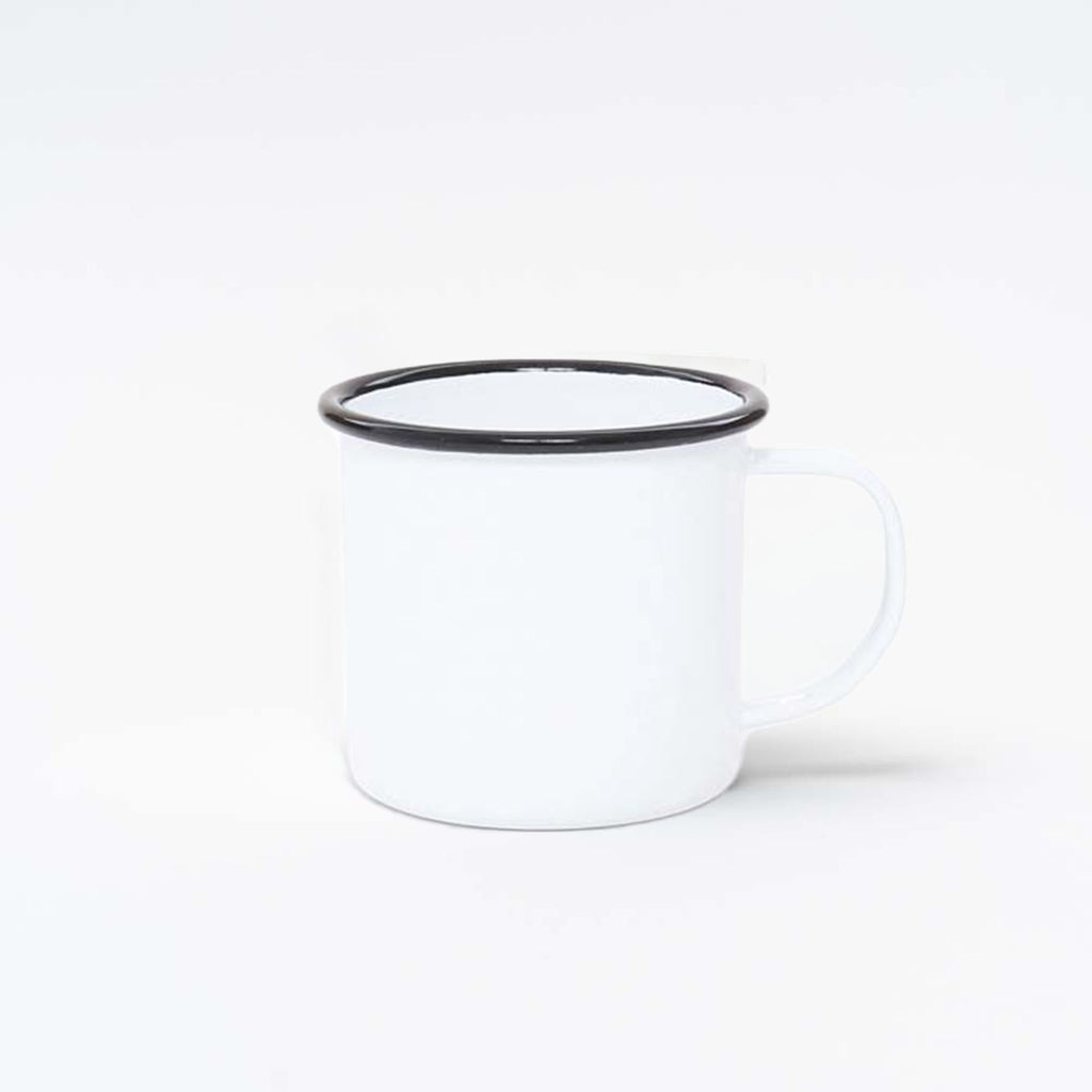 White enamel mug with black trim on white background.