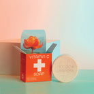 Vitamin C soap packaging with a bar of soap on a gradient background