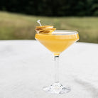 Simon Pearce Vintner Coupe on a white table at Addison West