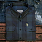 Warren Six Season Flannel in Deepwater on a table at Addison West
