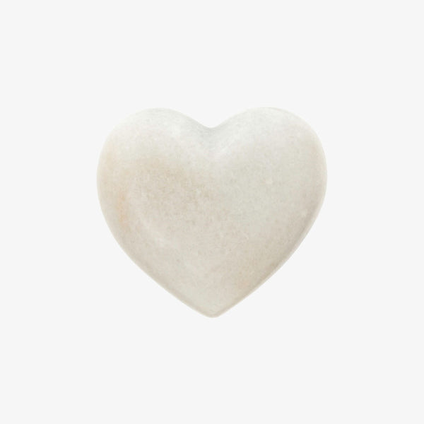 White marble heart on a white background