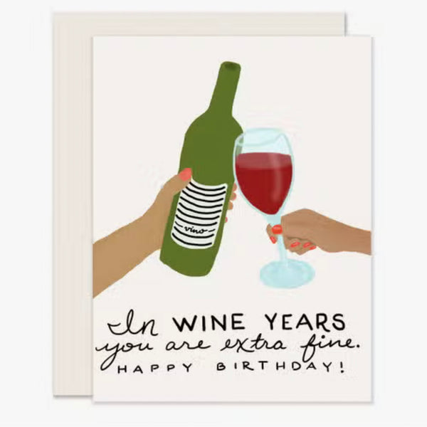 Birthday card with wine bottle and glass toasting and text saying In wine years you are extra fine. 