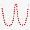 Red wool and wood bead garland on a white background