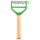 Opinel peeler with green handle and wooden handle on a white background