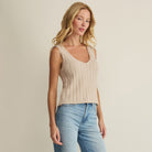 Woman wearing Z Supply Acadia Sweater Tank in Island Coconut on plain background at Addison West.