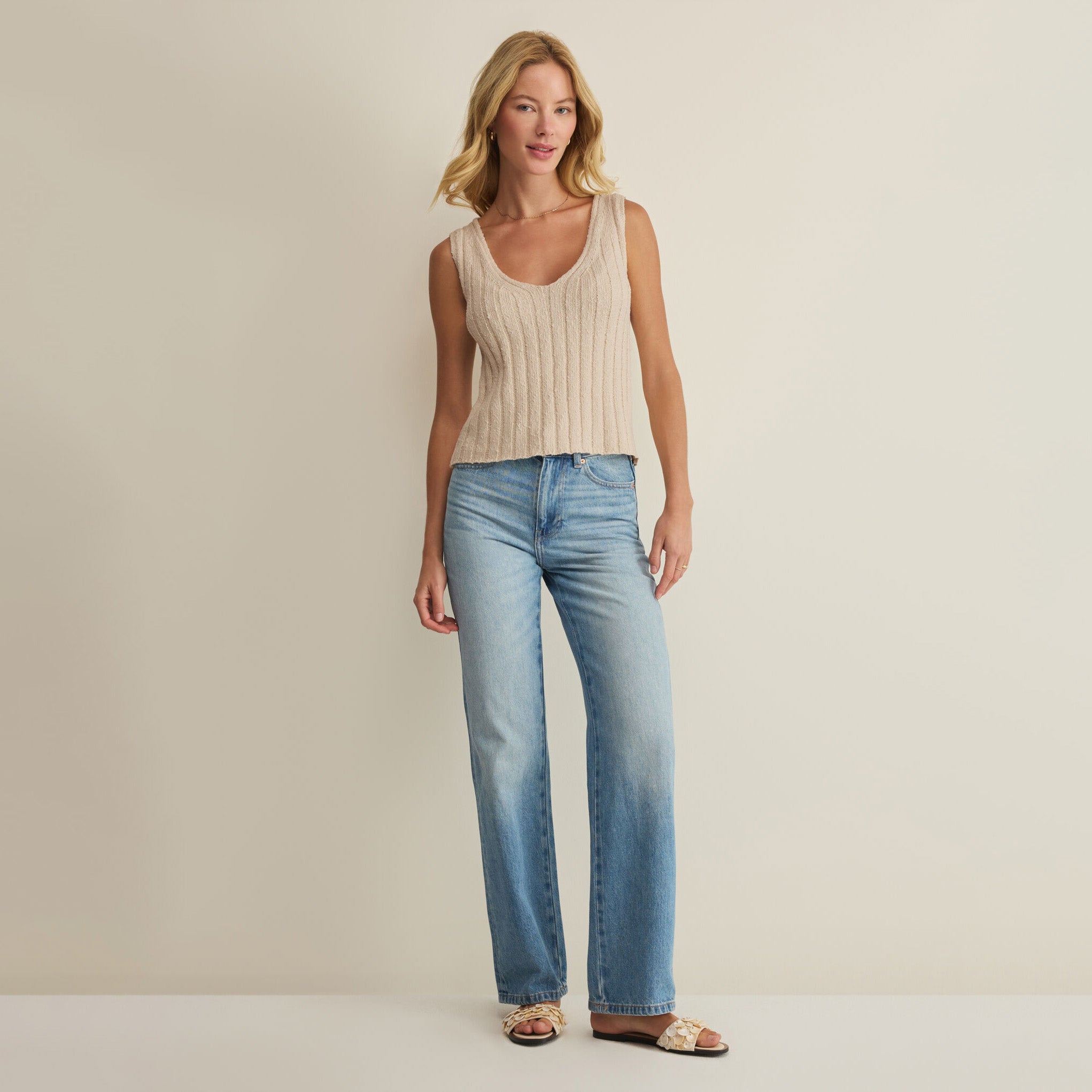 Woman wearing Z Supply Acadia Sweater Tank in Island Coconut on plain background at Addison West.