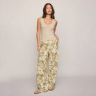 Woman wearing Z Supply Acadia Sweater Tank in Island Coconut on plain background at Addison West.