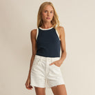 Woman wearing Z Supply Clarke Rib Tank in Eclipse on plain background at Addison West.