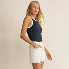 Woman wearing Z Supply Clarke Rib Tank in Eclipse on plain background at Addison West.