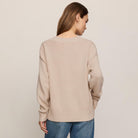 Z Supply Cloud Spun V-neck Sweater in Frosted Pearl shown on model on plain background.