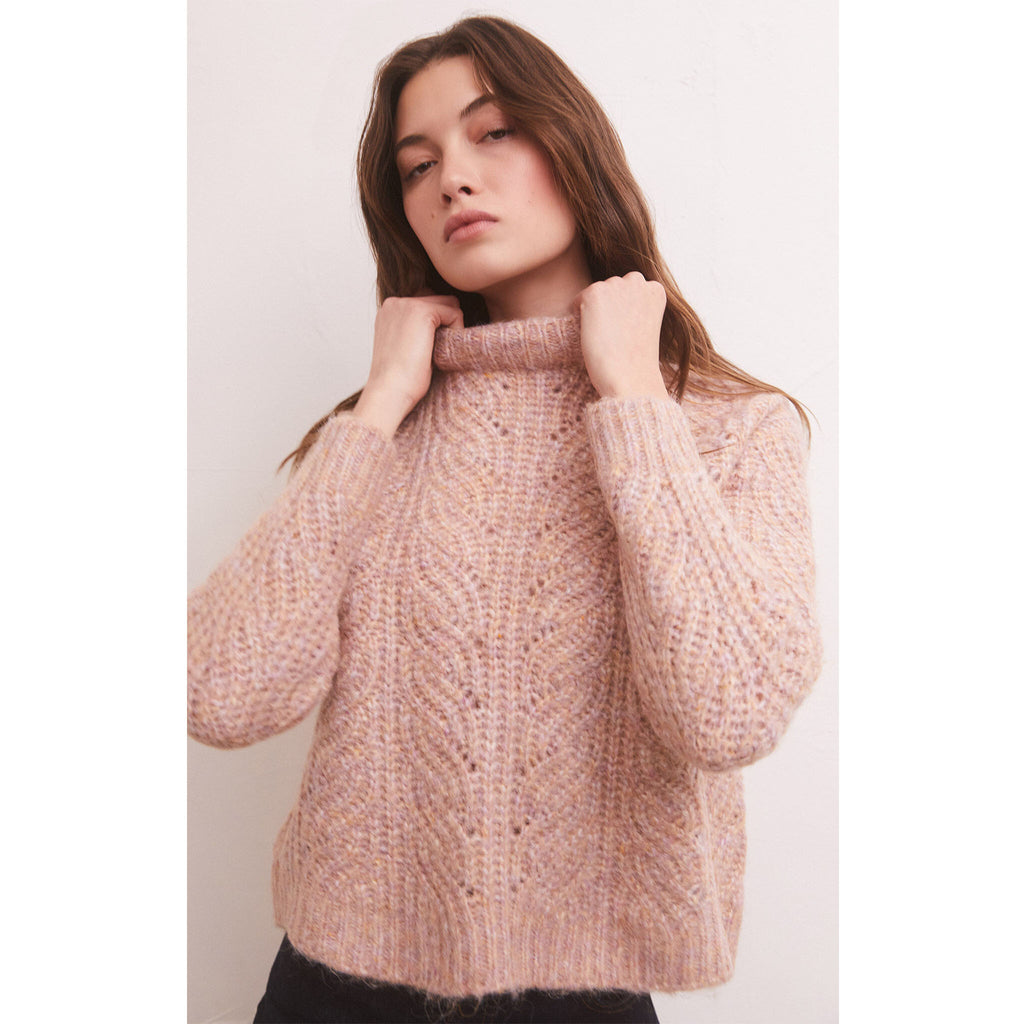 Z Supply Dove Sweater in Shadow Mauve on model with brown hair in front of a white wall 