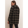 Model wearing black pants and loafers and Z Supply Hastings Sherpa Coat in front of a neutral wall