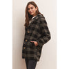 Model wearing black pants and loafers and Z Supply Hastings Sherpa Coat in front of a neutral wall