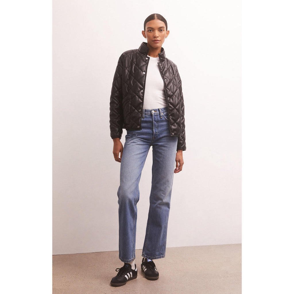 Model wearing jeans and adidas black sneakers with Z Supply Heritage Faux Leather Jacket in Black