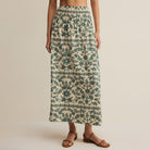 Woman wearing Z Supply Leya Tera Paisley Maxi Skirt in Everglade on plain background at Addison West.