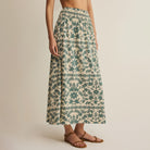 Woman wearing Z Supply Leya Tera Paisley Maxi Skirt in Everglade on plain background at Addison West.