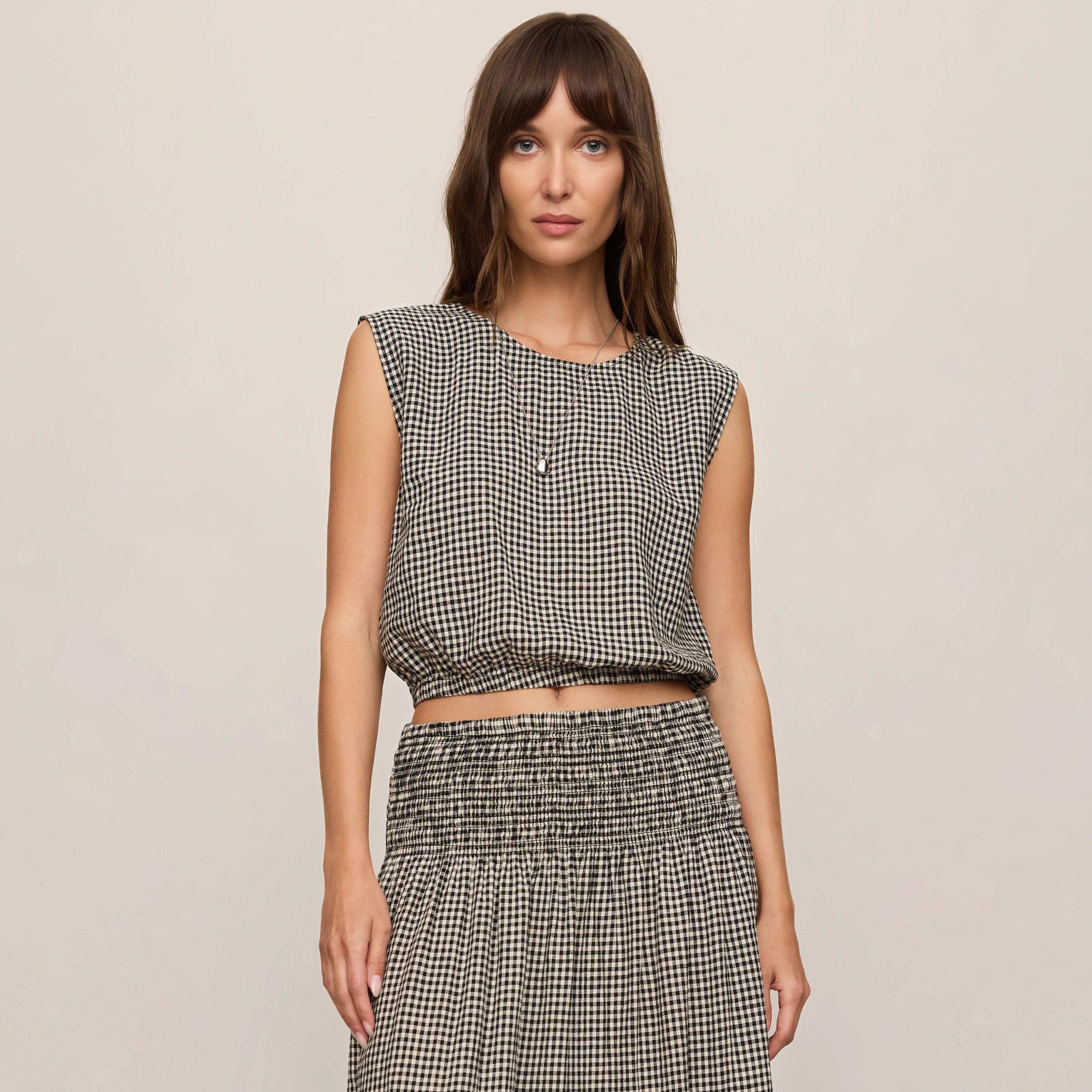Z Supply Merit Gingham Top in Black shown on model on plain background.