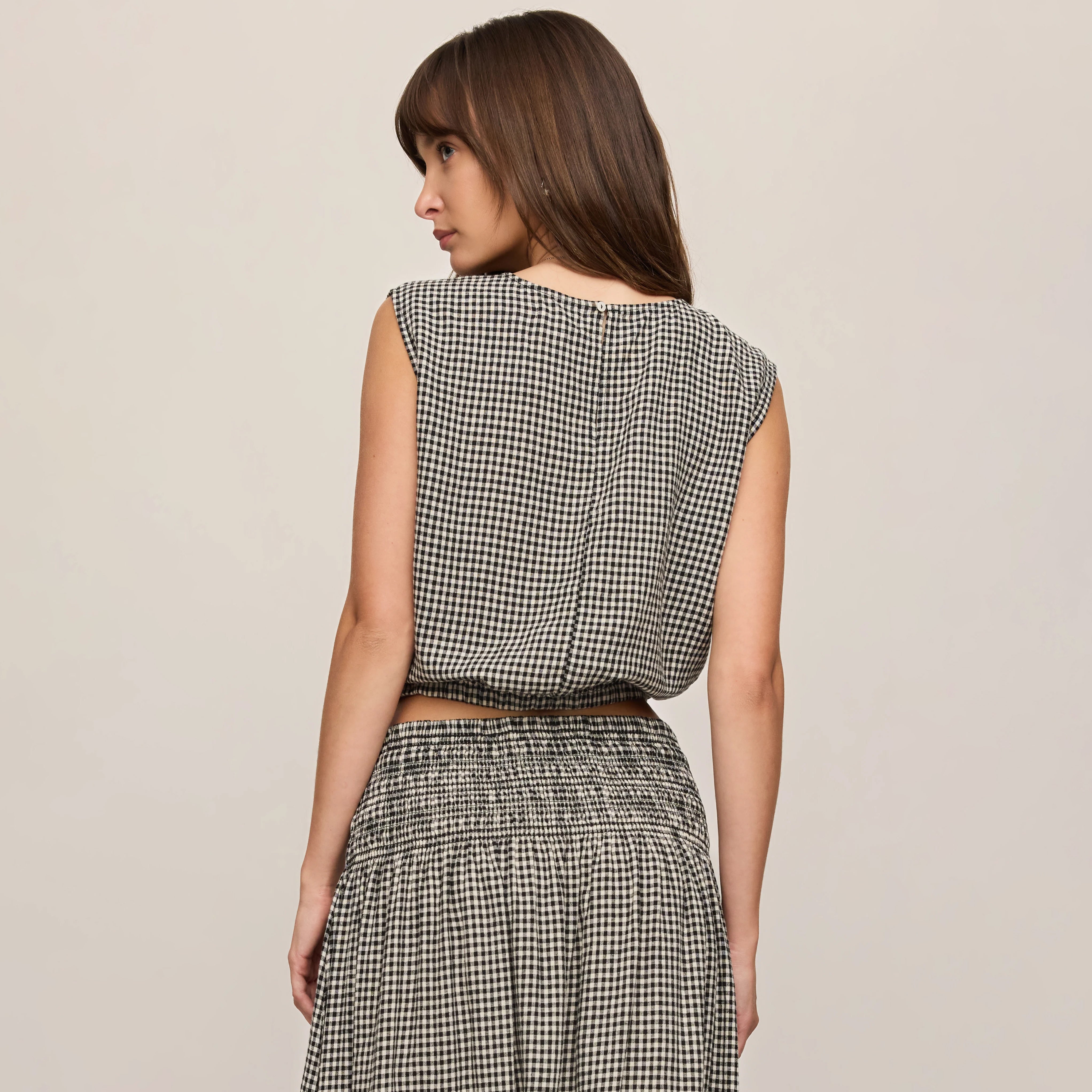 Z Supply Merit Gingham Top in Black shown on model on plain background.