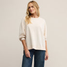Woman wearing Z Supply Modern Weekender in Crystal against a plain background