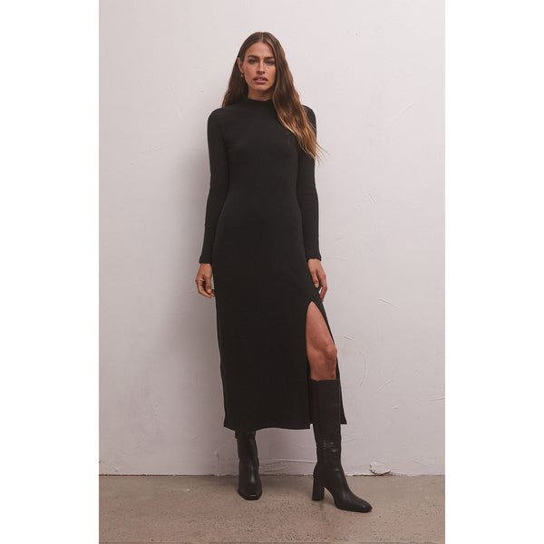 Model wearing Z Supply Ophelia Mock Neck Dress in Black with black boots