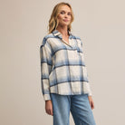 Z Supply River Plaid Button Up in Vintage Indigo on a beige background at Addison West
