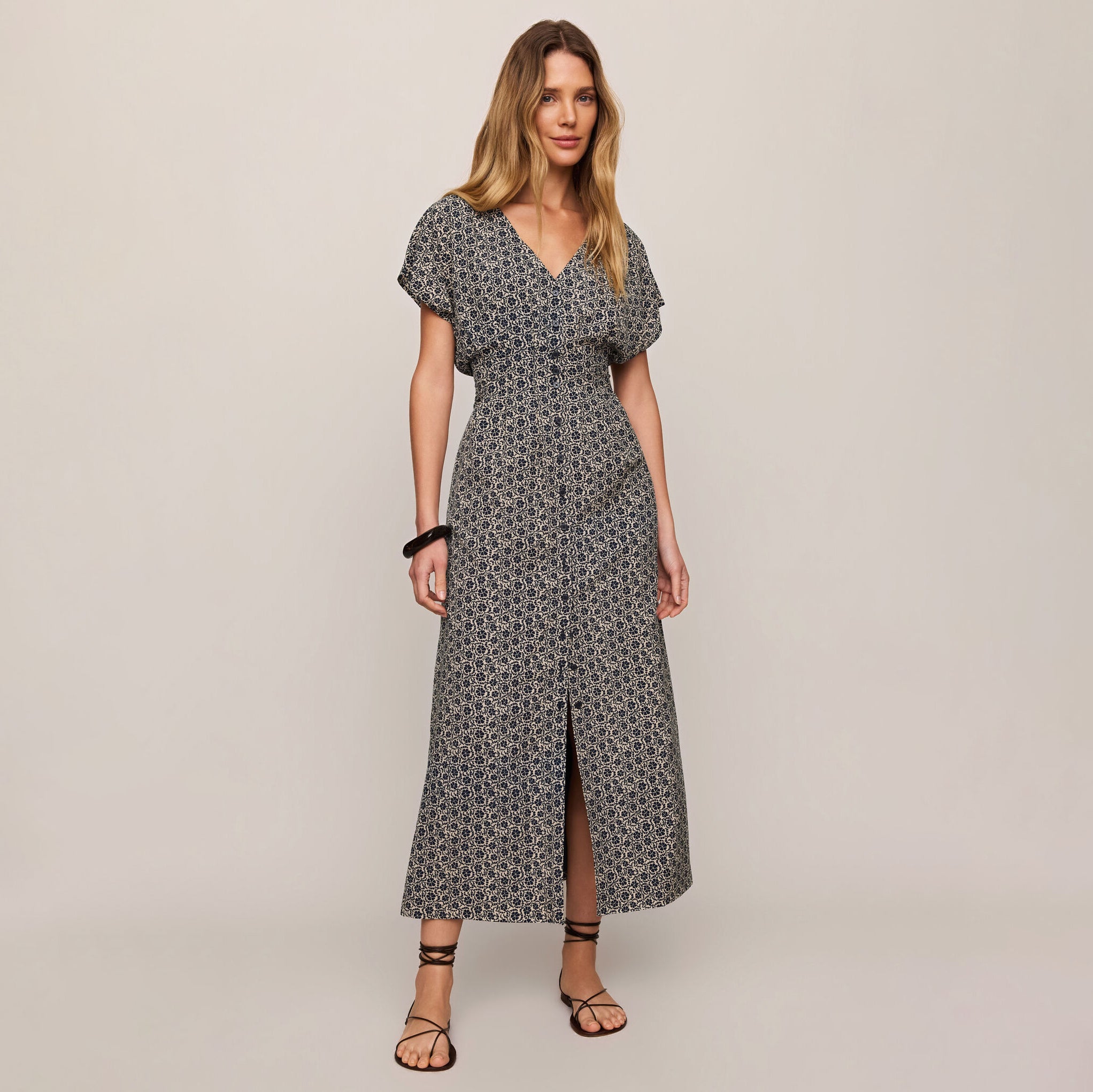 Z Supply Sanna Iris Floral Midi Dress in Eclipse shown on model on plain background.