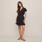 Z Supply Sanna Mini Dress in Black shown on model on plain background.
