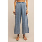Model wearing Z Supply Scout Jersey Denim Pant in Medium Indigo in front of a neutral backdrop