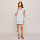 Woman wearing Z Supply Shellbound Striped Dress in Sea Salt on plain background at Addison West.