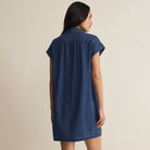 Woman wearing Z Supply Shellbound Twill Dress in Twilight Blue on plain background at Addison West.
