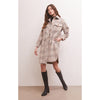 Model wearing Z Supply Sonoma Plaid Jacket in Orchid Rain with black boots in front of a beige wall 