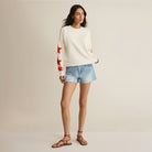 Woman wearing Z Supply Stars First Date Sweatshirt in Sea Salt on plain background at Addison West.