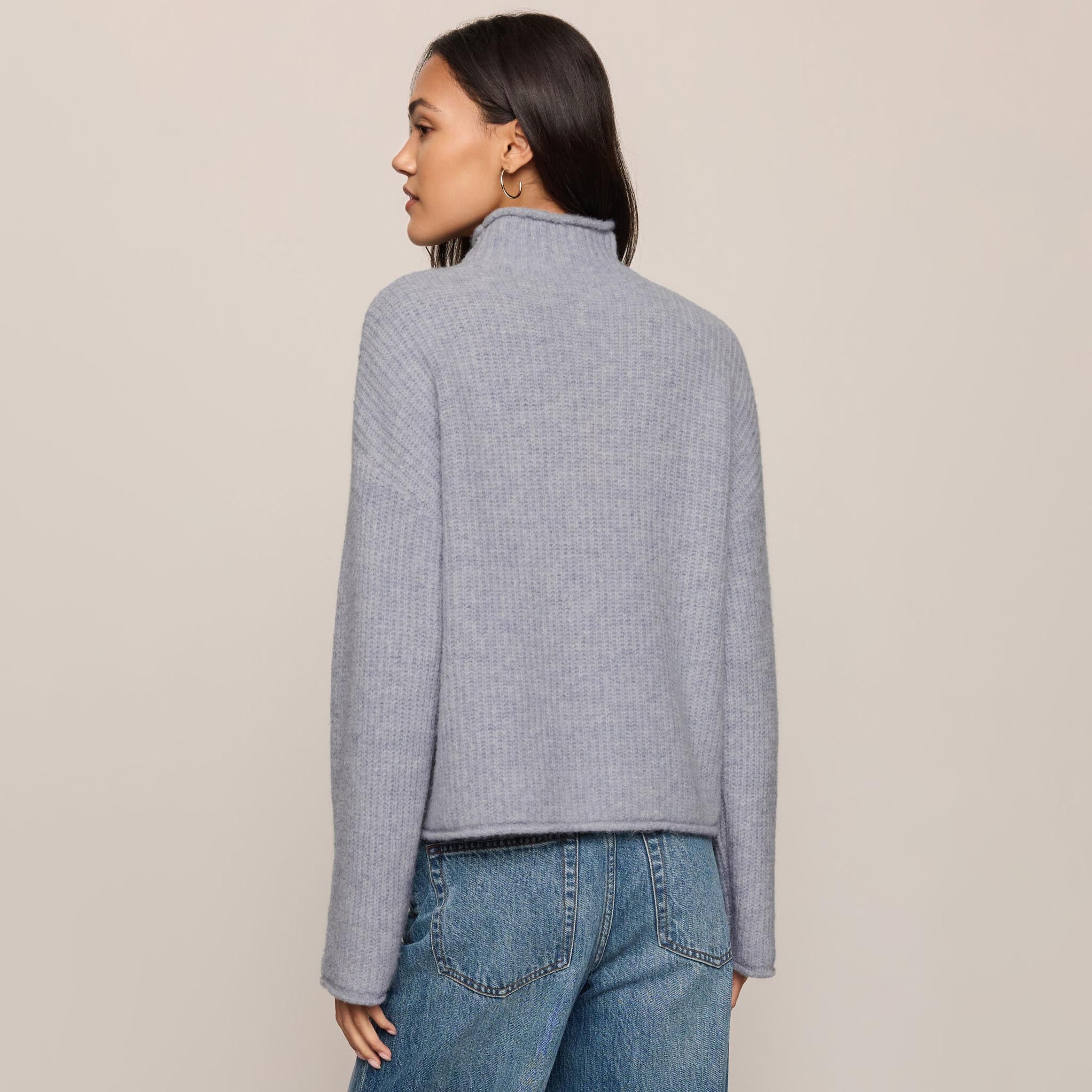 Z Supply Warm Wishes Sweater in Silverlake shown on model on plain background.
