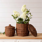 Wicker Storage Baskets With Lids on a table with flowers at Addison West