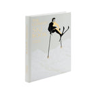 Book titled 'The Ultimate Ski Book' in leather by graphic image with a cover illustration of a skier on a white background