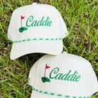 Caddie Baseball Hat on the grass at Addison West