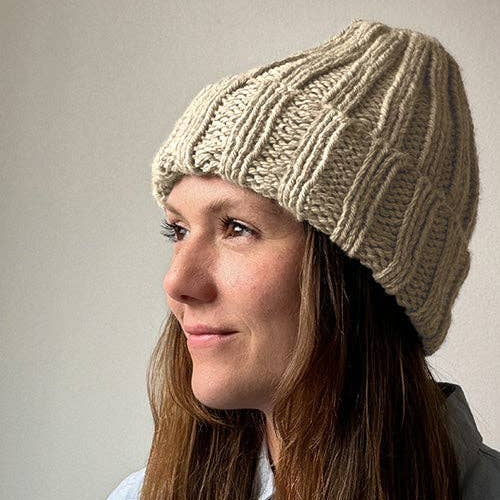 Knitting Craft Kit: Shoreline Beanie in Sand on a beige background at Addison West