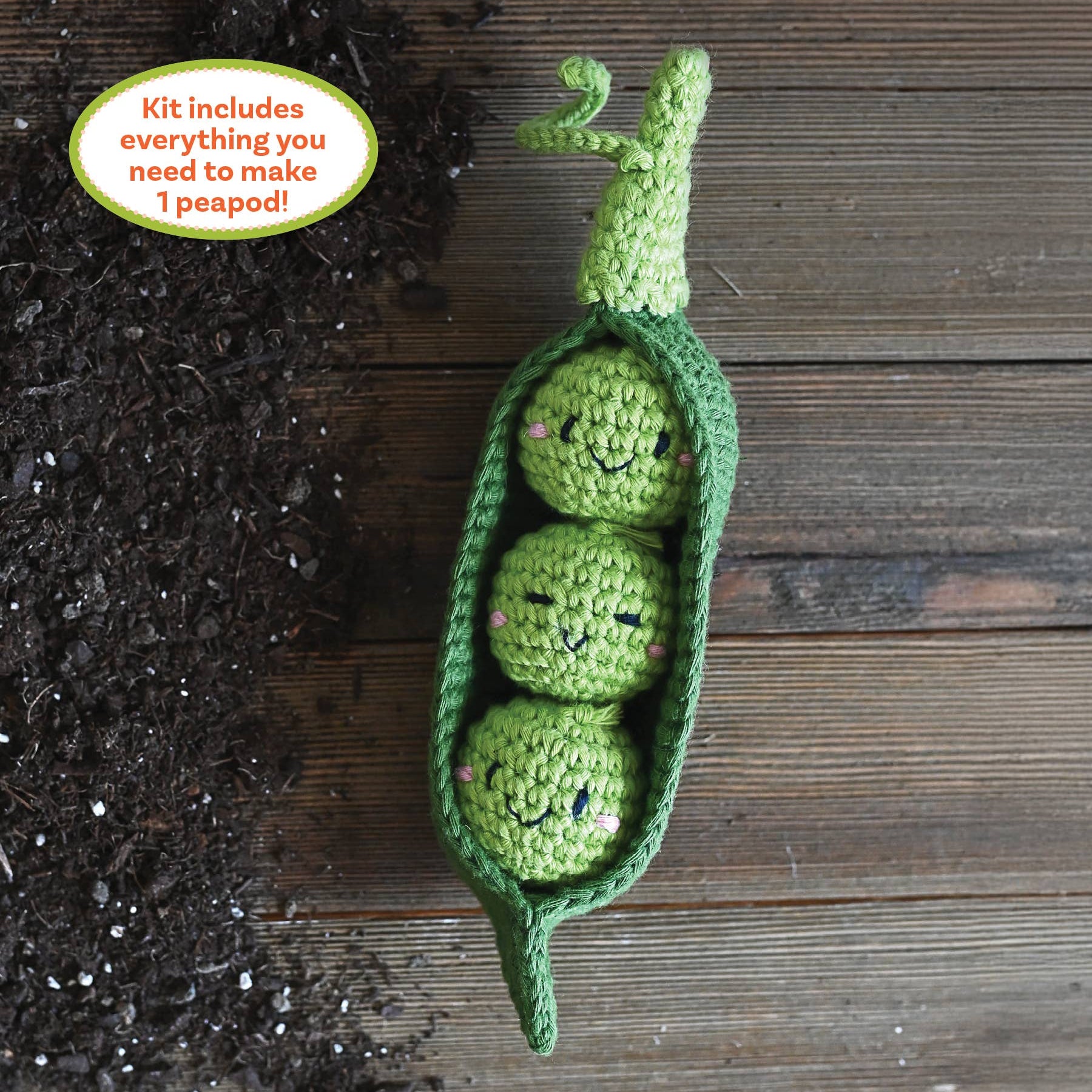 Crochet Your Veggies Peapod Amigurumi Kit on a wood table at Addison West