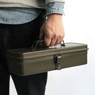 Toyo Steel Toolbox T-320 in Military Green on a white background held by a model at Addison West