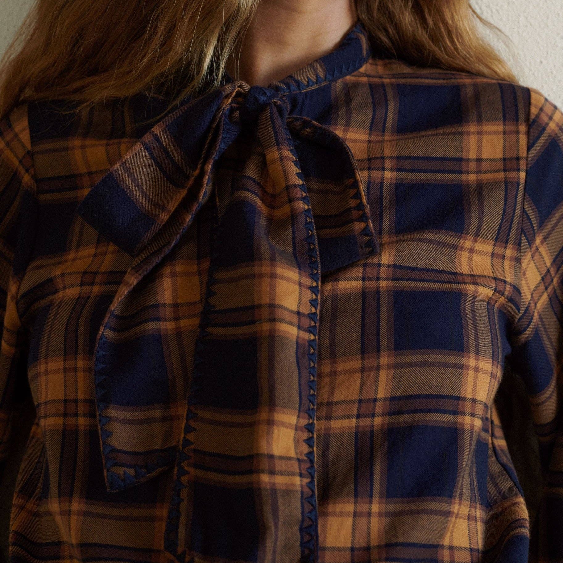 Lily Blouse in Navy on a white background at Addison West