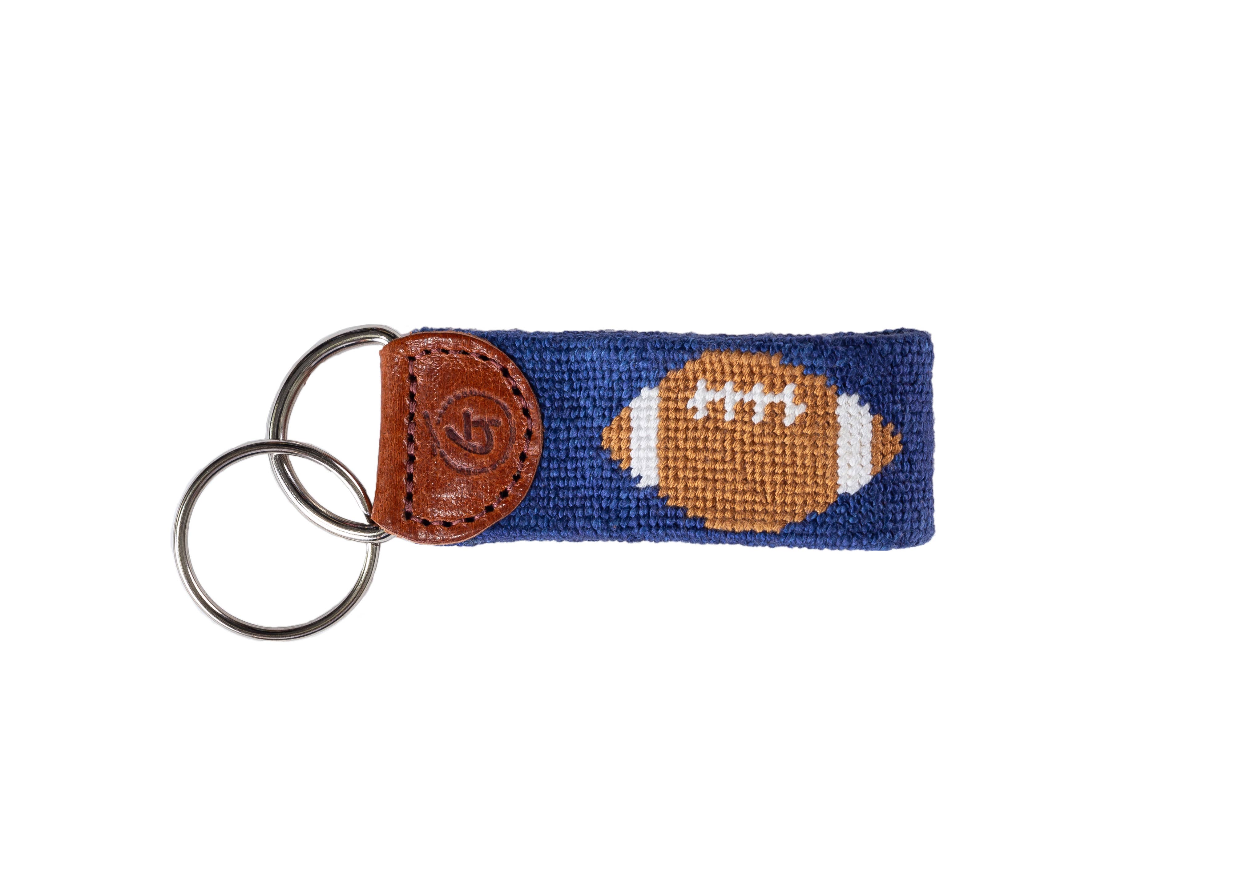 Needlepoint Keychain with football design on a blue background