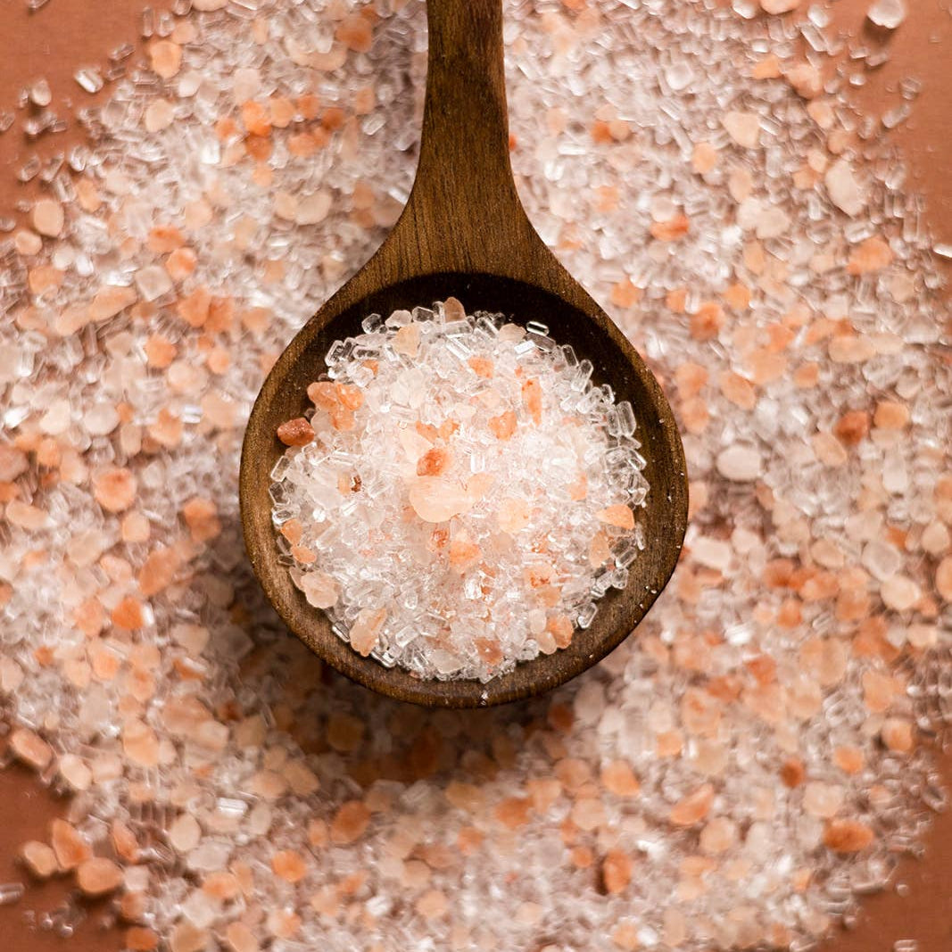 Afterglow Bath Salts in an orange background at Addison West