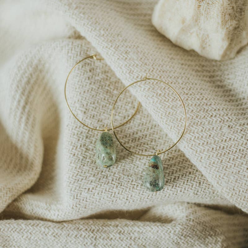Commonform Aurora Hoops in Turquoise on textured background at the Addison West.
